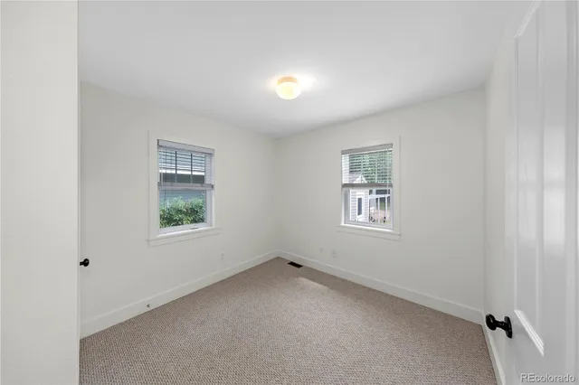 a view of house with a deck and furniture