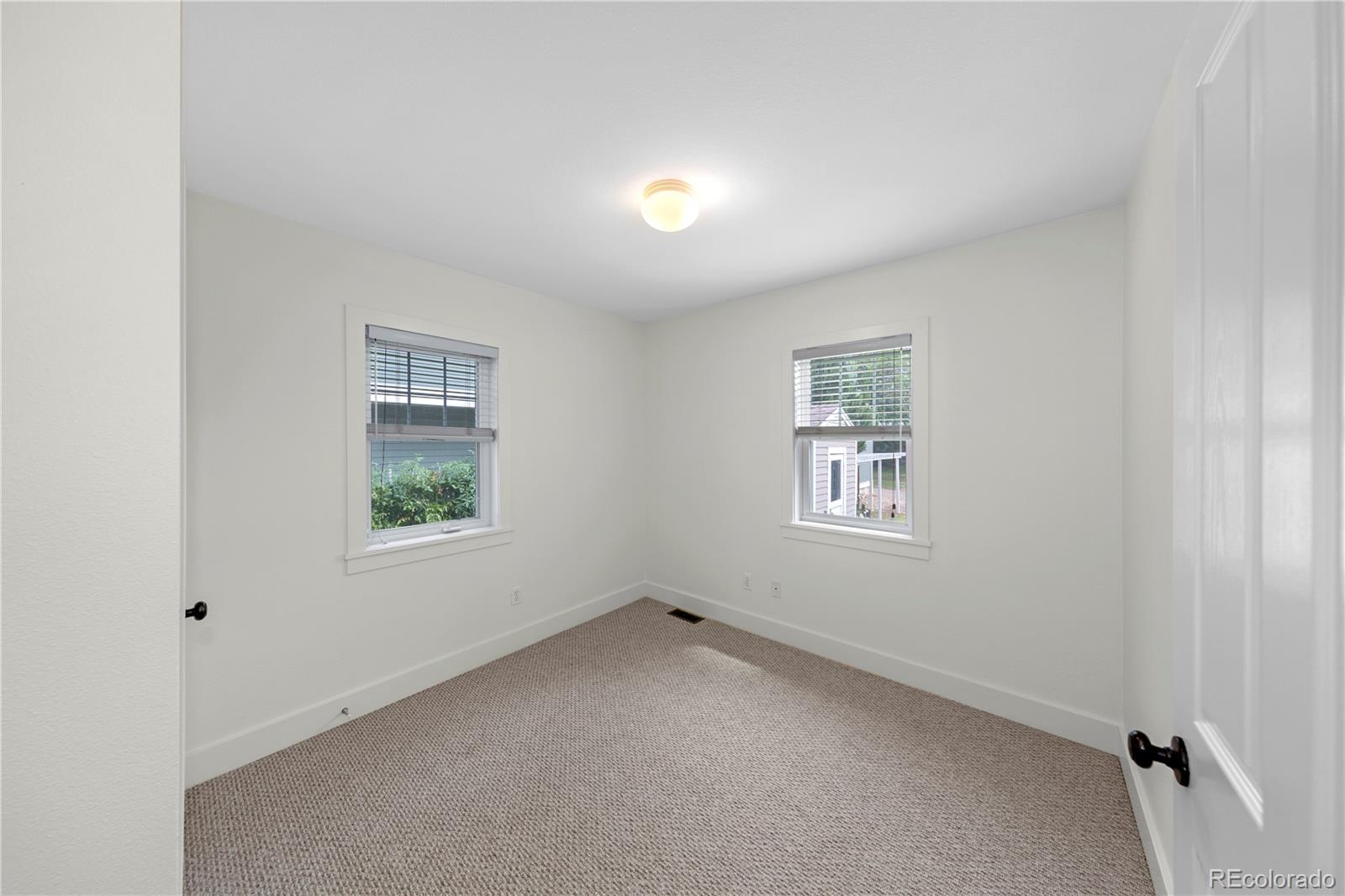 3056 8th Street Boulder, CO 80304 - Photo 22 of 45 an empty room with a window
