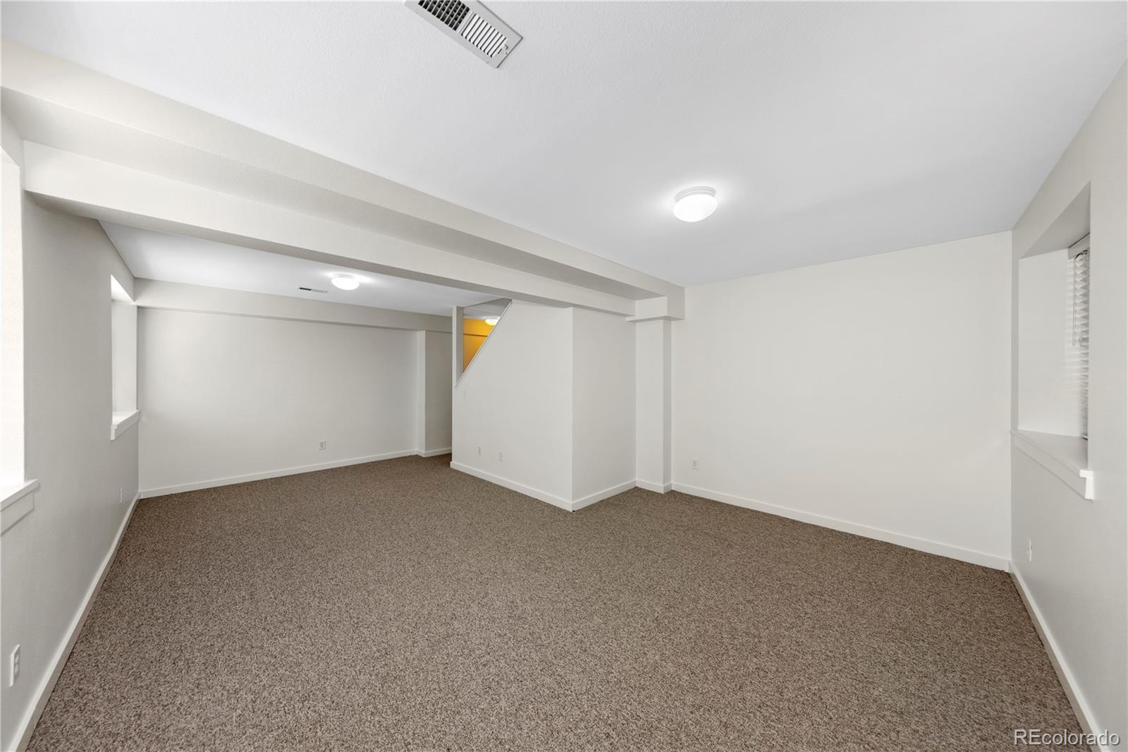 3056 8th Street Boulder, CO 80304 - Photo 23 of 45 an empty room with a empty space and windows