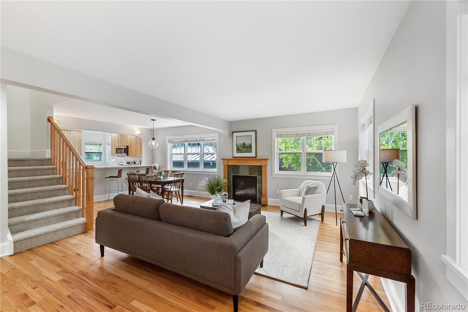 3056 8th Street Boulder, CO 80304 - Photo 3 of 45 a living room with fireplace furniture and a wooden floor