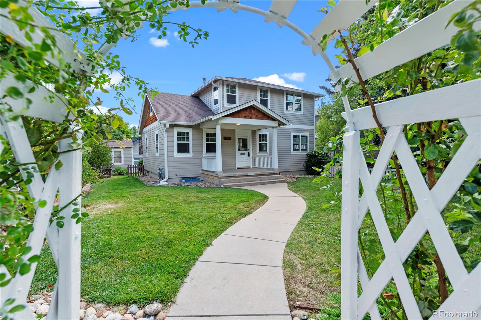 3056 8th Street Boulder, CO 80304 - Photo 32 of 45 a front view of a house with garden