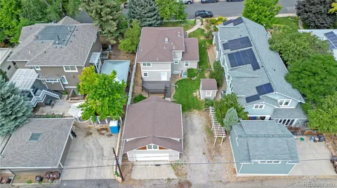a view of a lush green hillside and a houses
