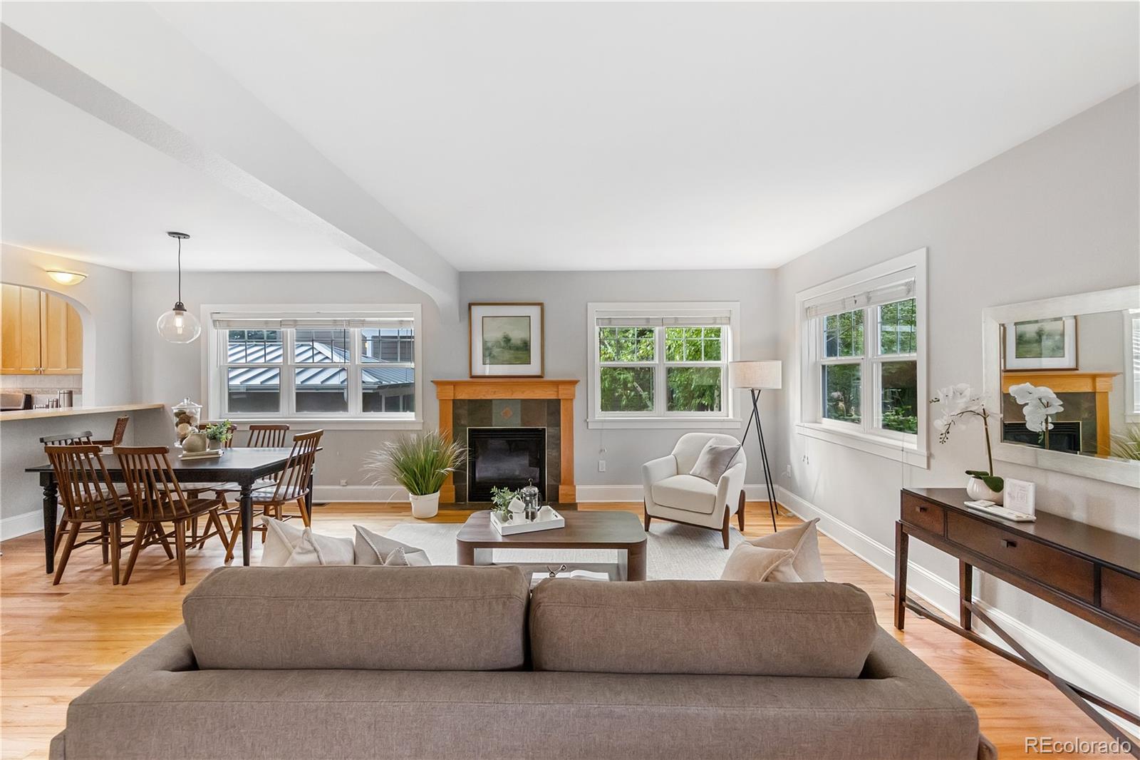 3056 8th Street Boulder, CO 80304 - Photo 5 of 45 a living room with furniture a fireplace and a large window
