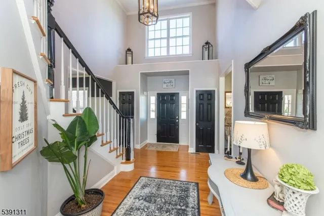 a lobby with furniture and a potted plant