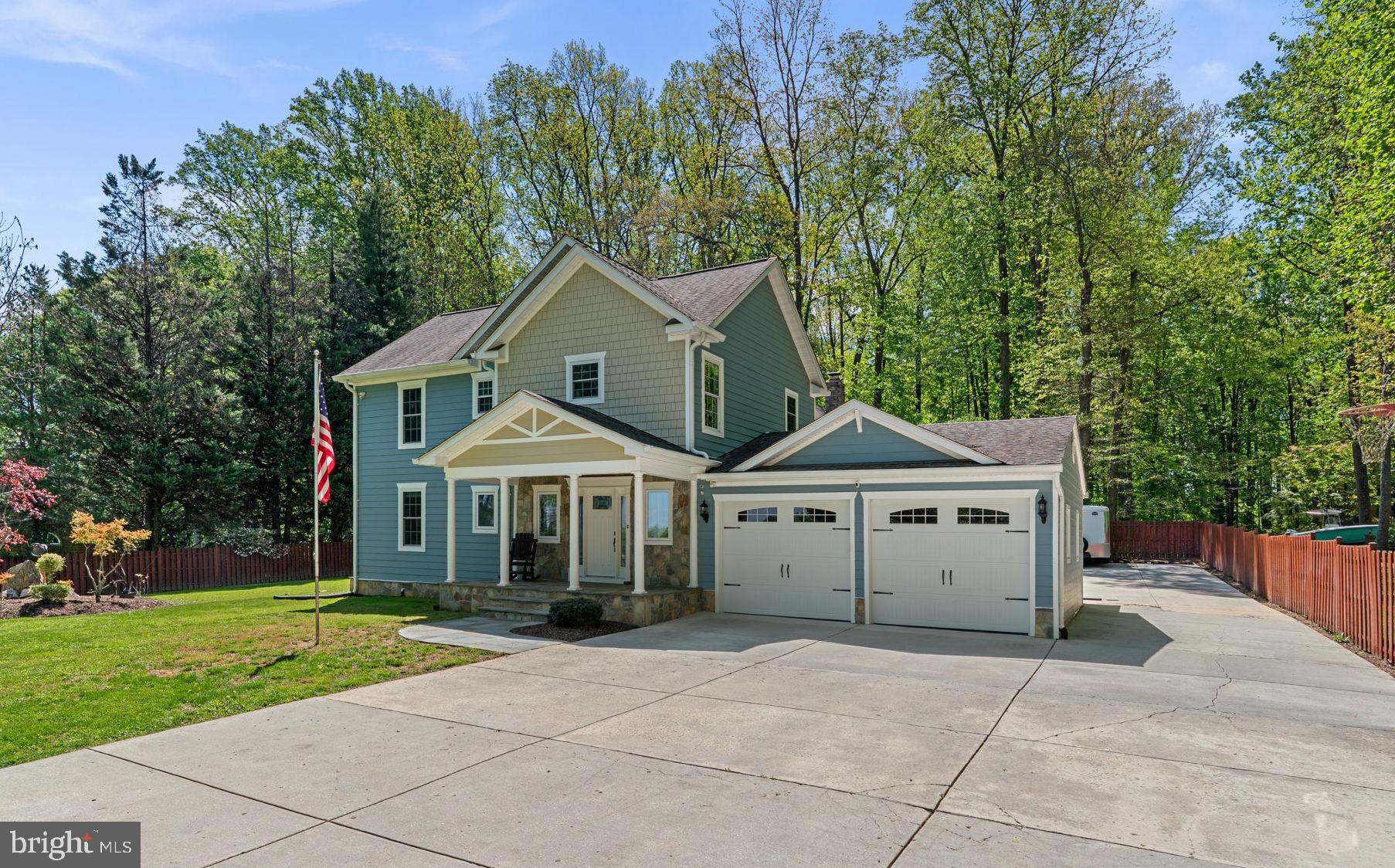 18611 Brooke Road Sandy Spring, MD 20860 - Photo 1 of 62 a front view of a house with garden