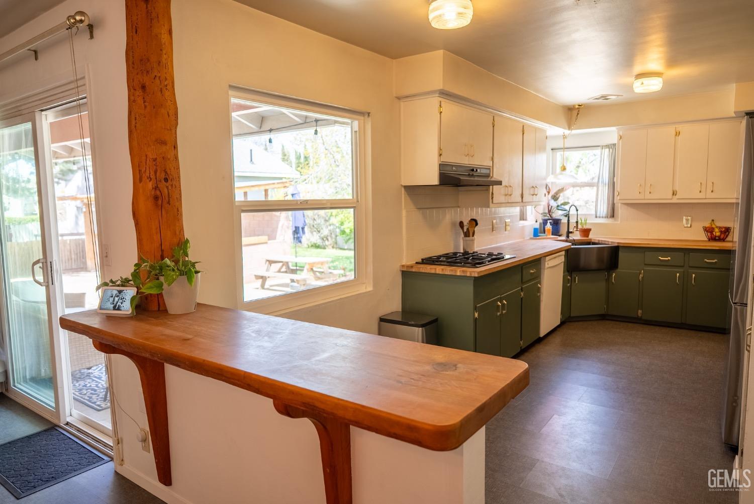 Undisclosed Address Tehachapi, CA 93561 - Photo 13 of 46 a kitchen with a sink a counter top space and stainless steel appliances