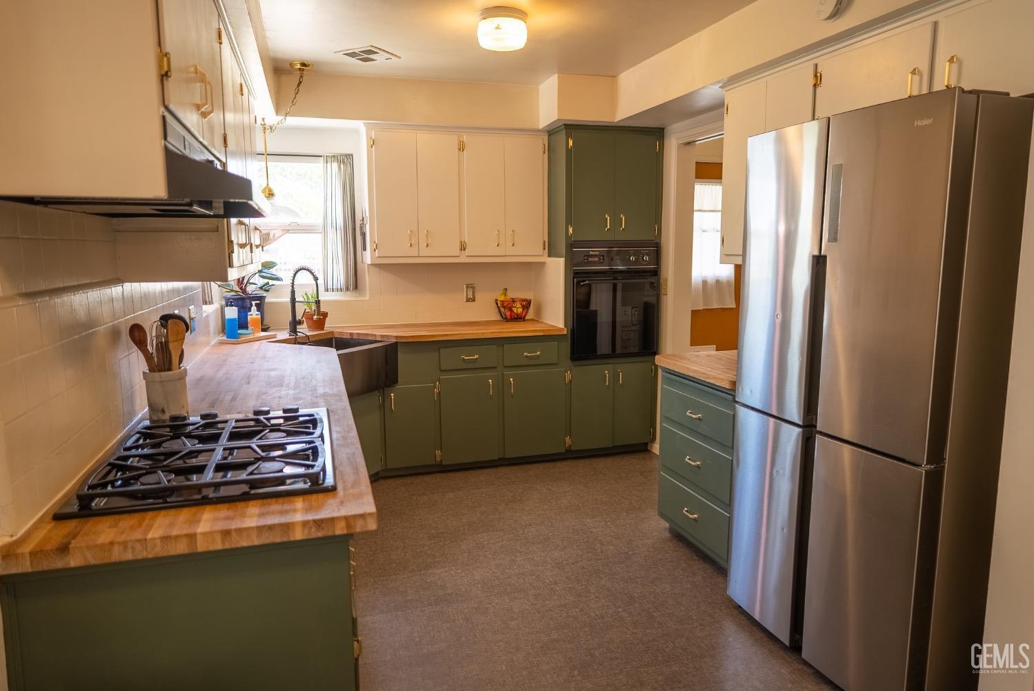 Undisclosed Address Tehachapi, CA 93561 - Photo 14 of 46 a kitchen with stainless steel appliances granite countertop a refrigerator and a stove