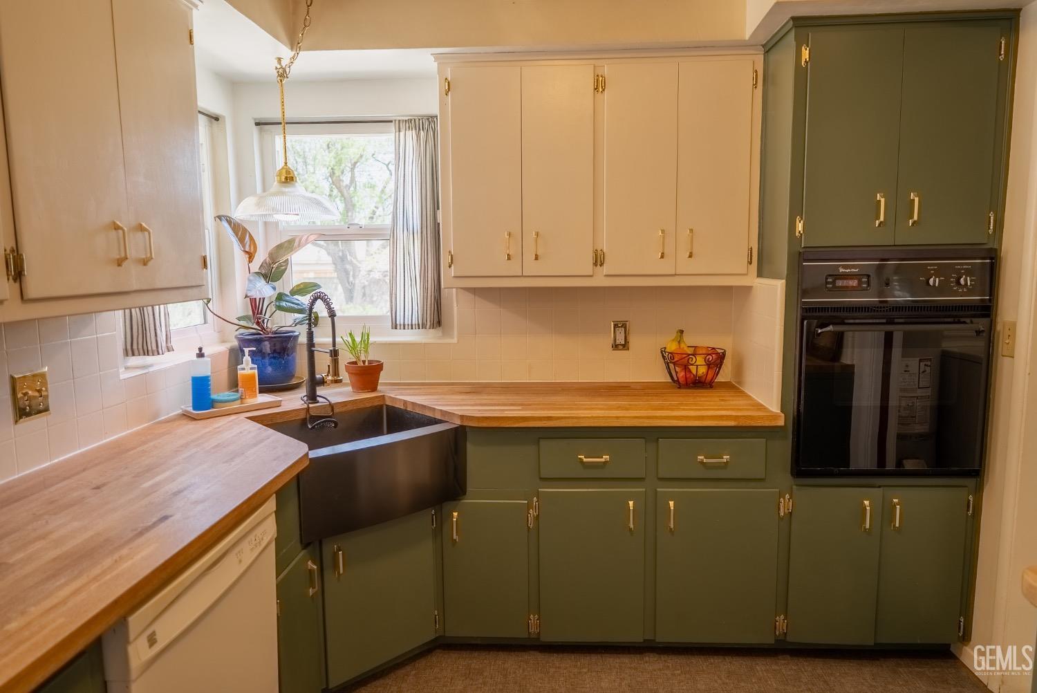 Undisclosed Address Tehachapi, CA 93561 - Photo 16 of 46 a kitchen with a sink cabinets and wooden floor