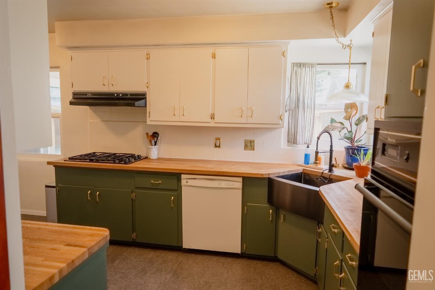 Undisclosed Address Tehachapi, CA 93561 - Photo 18 of 46 a kitchen with stainless steel appliances granite countertop a sink stove and refrigerator
