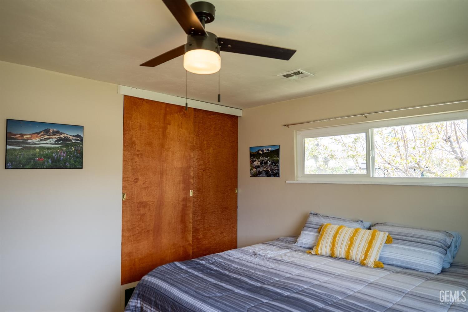 Undisclosed Address Tehachapi, CA 93561 - Photo 28 of 46 a bedroom with a bed and a window