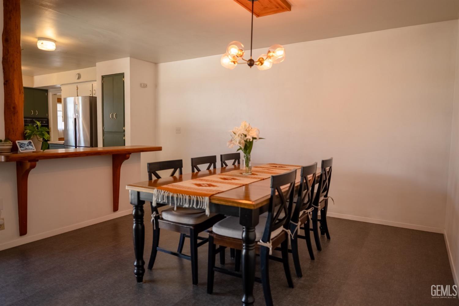 Undisclosed Address Tehachapi, CA 93561 - Photo 9 of 46 a view of a dining room with furniture and chandelier