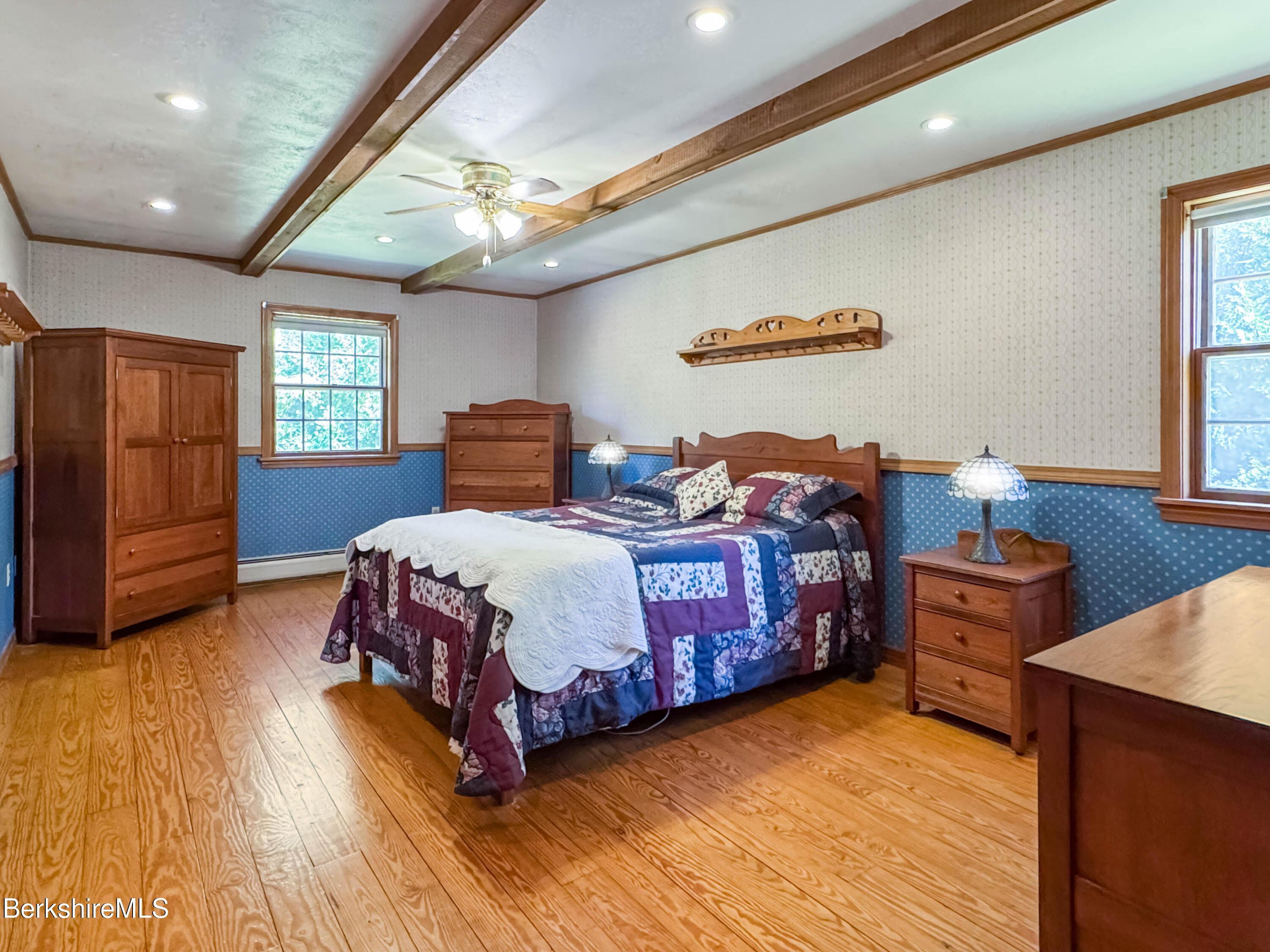 829 Main Road Savoy, MA 01256 - Photo 24 of 38 a bedroom with a bed and wooden floor