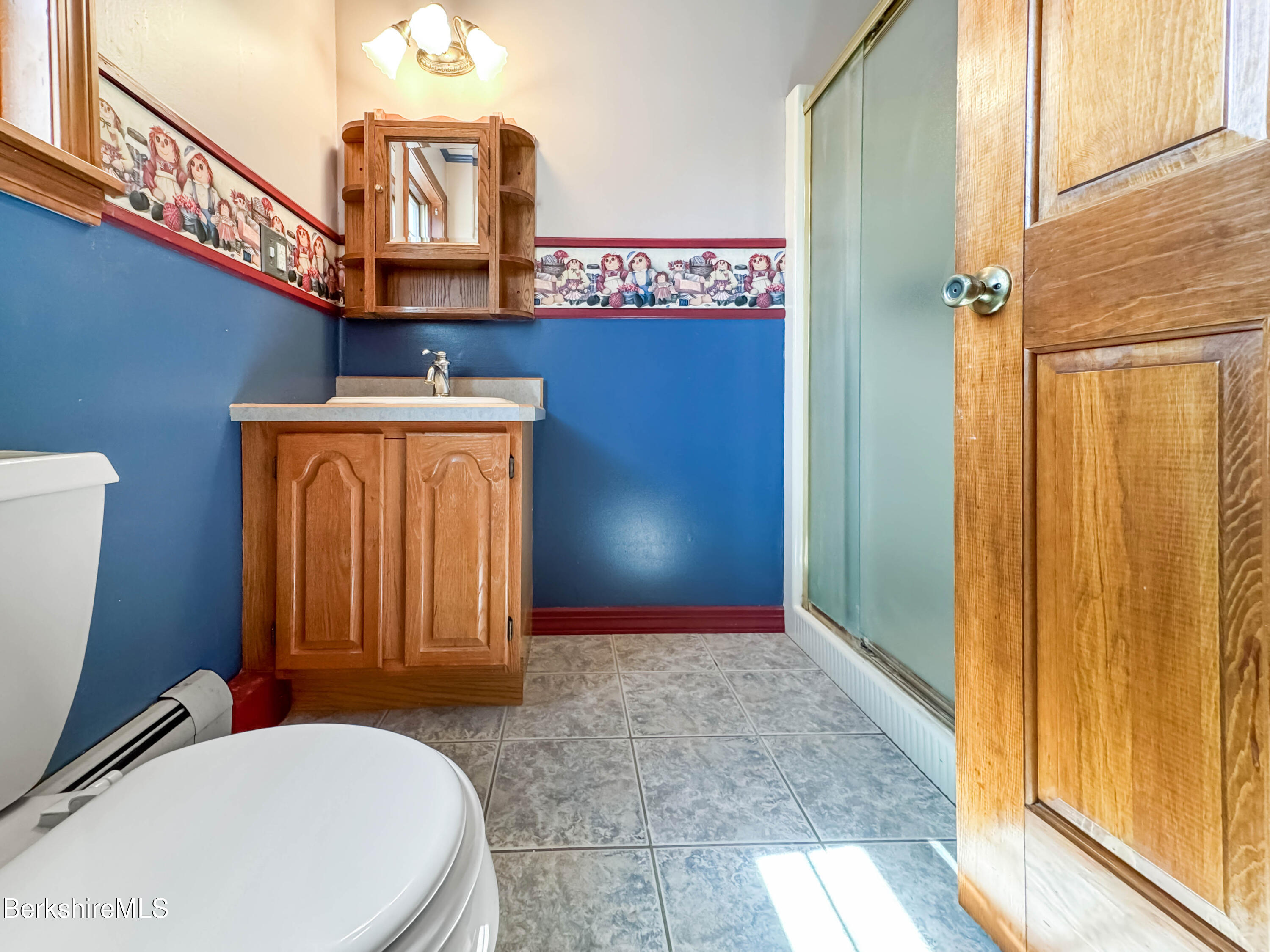 829 Main Road Savoy, MA 01256 - Photo 27 of 38 a bathroom with a toilet a sink and mirror