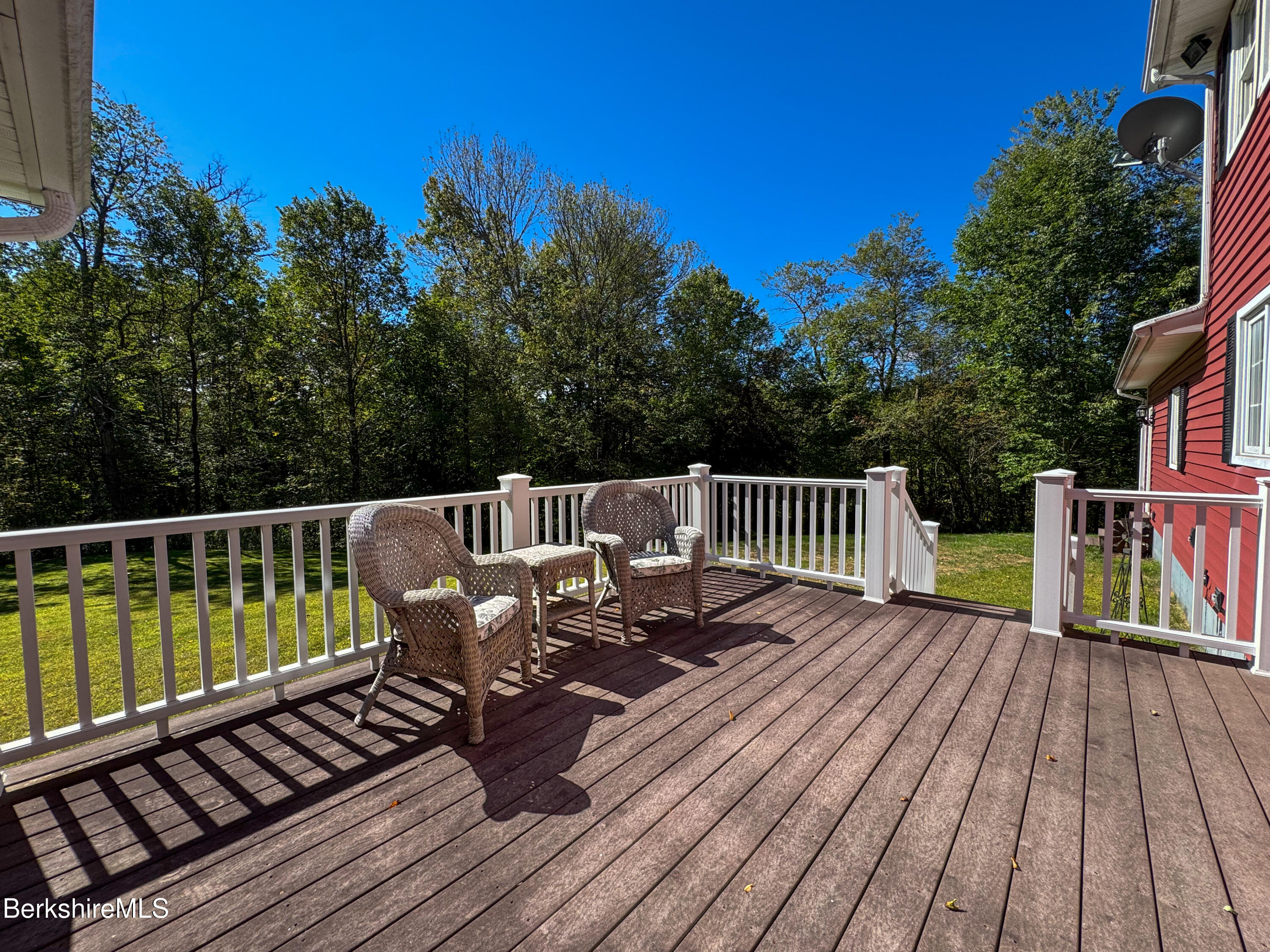 829 Main Road Savoy, MA 01256 - Photo 33 of 38 a view of a deck with wooden floor and seating space