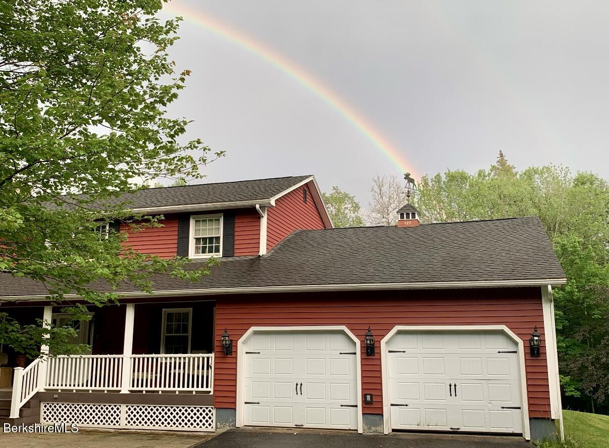 829 Main Road Savoy, MA 01256 - Photo 38 of 38 a front view of a house with a garage