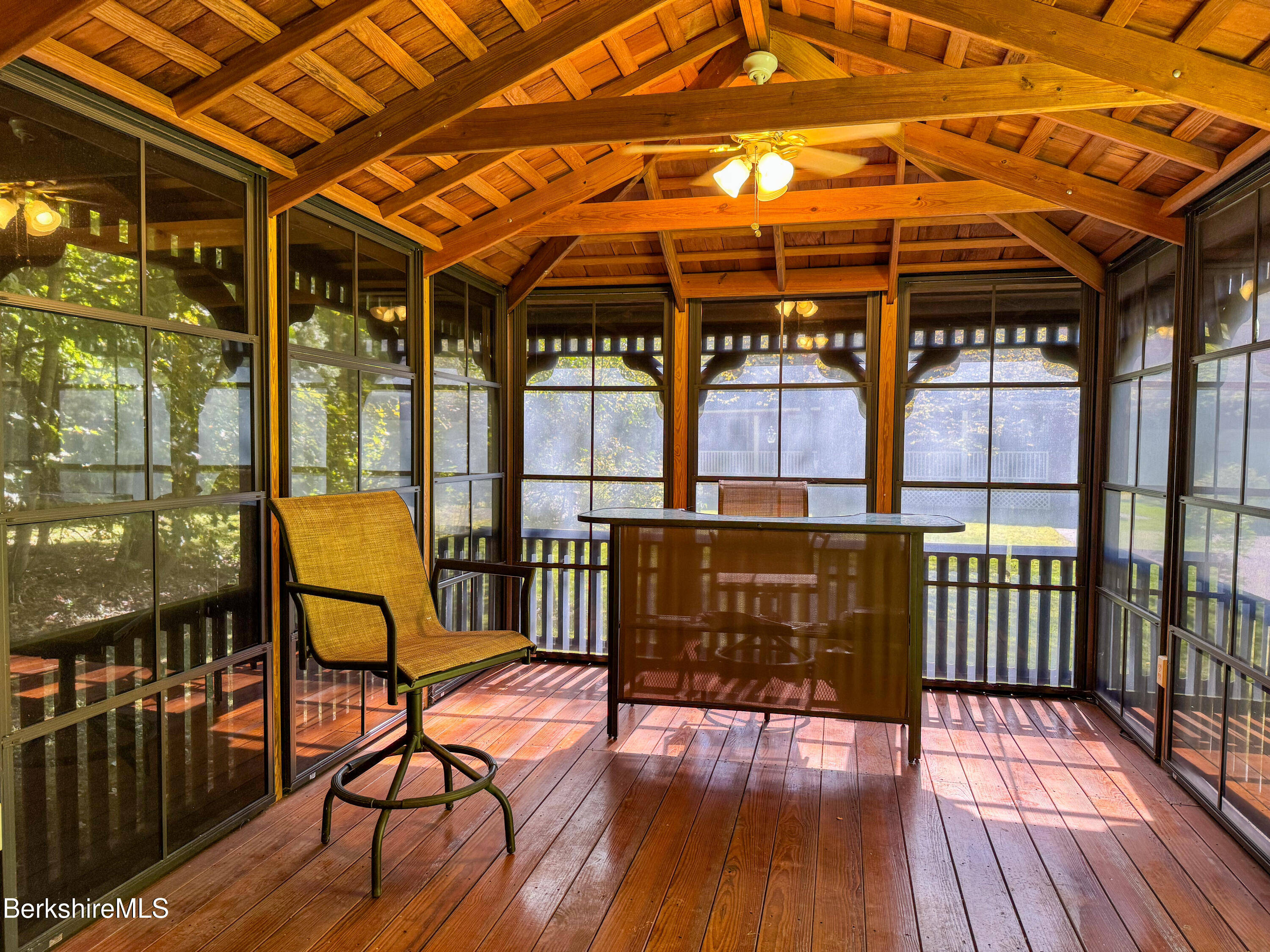 829 Main Road Savoy, MA 01256 - Photo 4 of 38 a porch with seating area and glass door