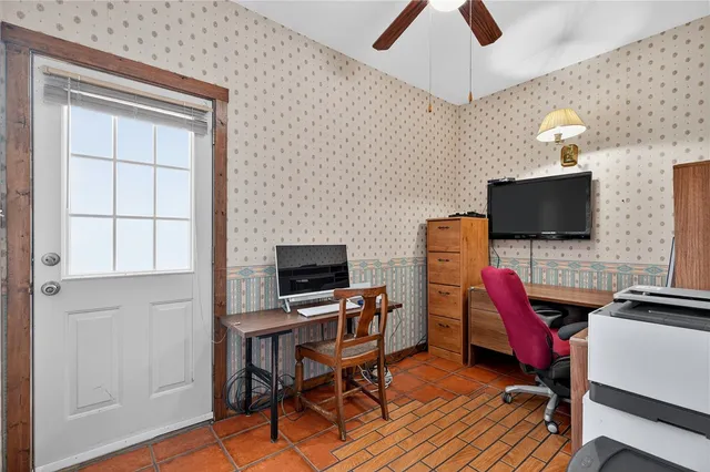 a view of a livingroom with furniture and a flat screen tv