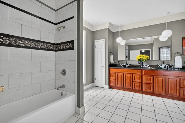 a bathroom with a double vanity sink and a toilet