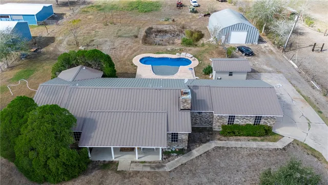 an aerial view of multiple houses with yard