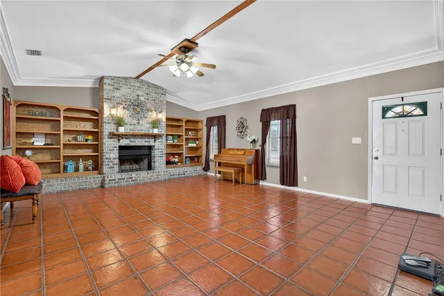 a view of a livingroom with furniture and a flat screen tv
