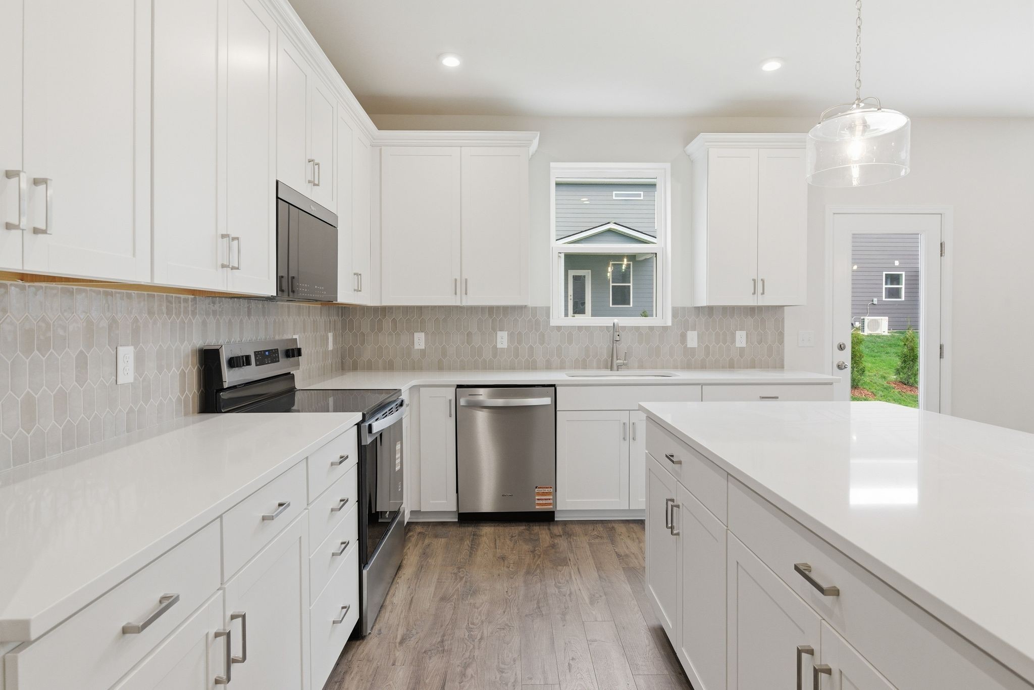 1310 Godwin Road Hermitage, TN 37076 - Photo 14 of 32 a kitchen with cabinets appliances a sink and a counter top