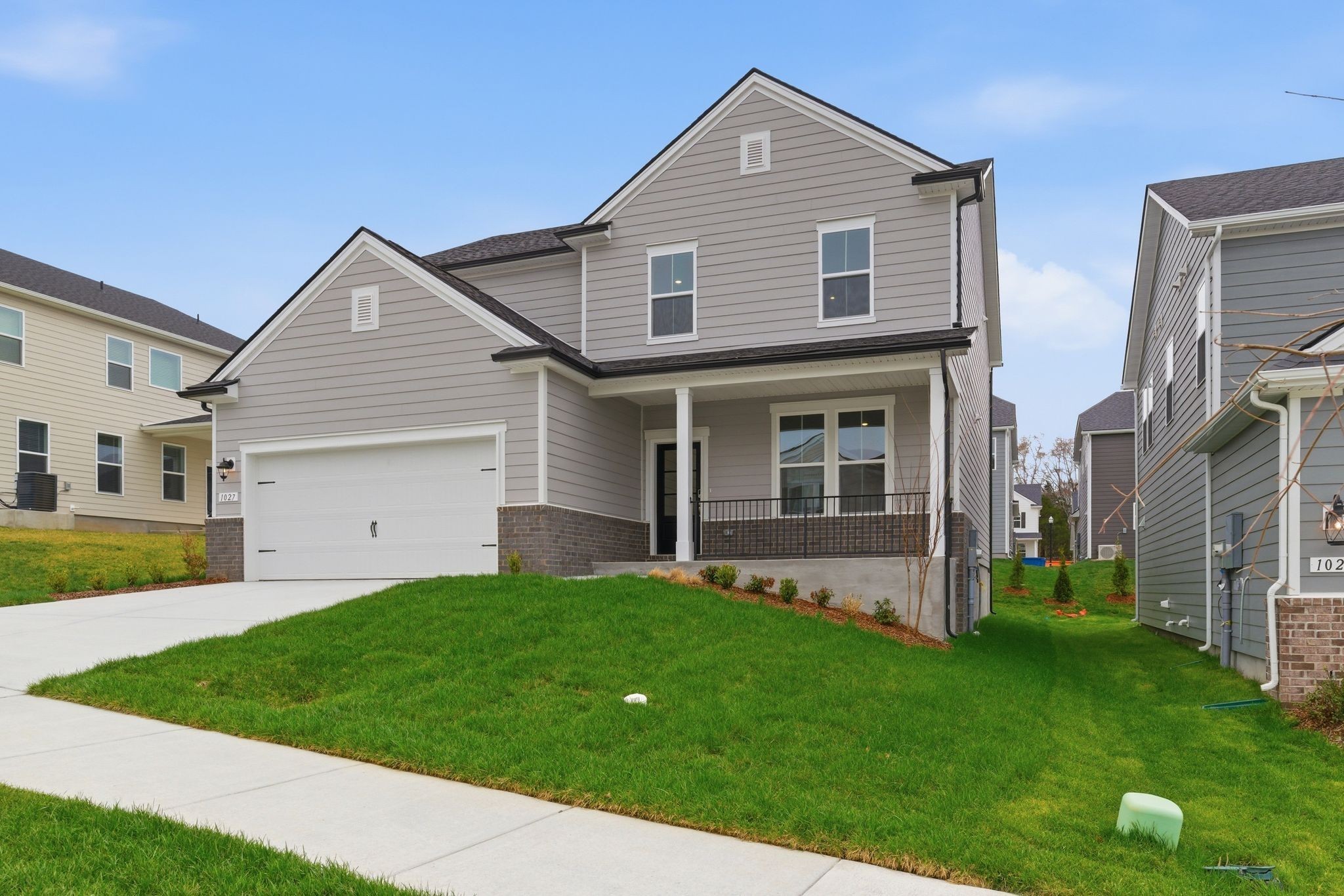 1310 Godwin Road Hermitage, TN 37076 - Photo 2 of 32 a front view of a house with a yard and garage