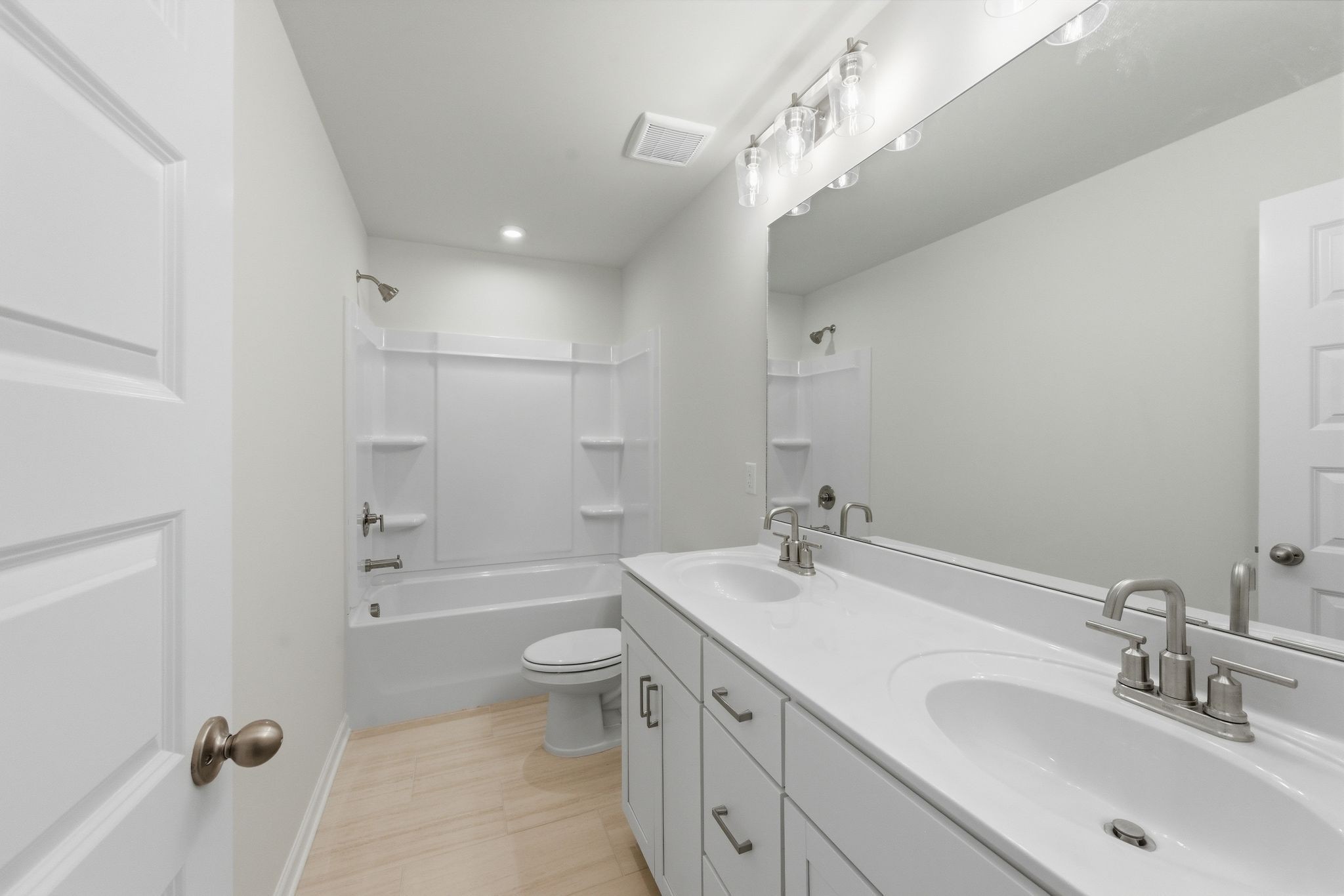 1310 Godwin Road Hermitage, TN 37076 - Photo 26 of 32 a bathroom with a double vanity sink toilet mirror and bathtub