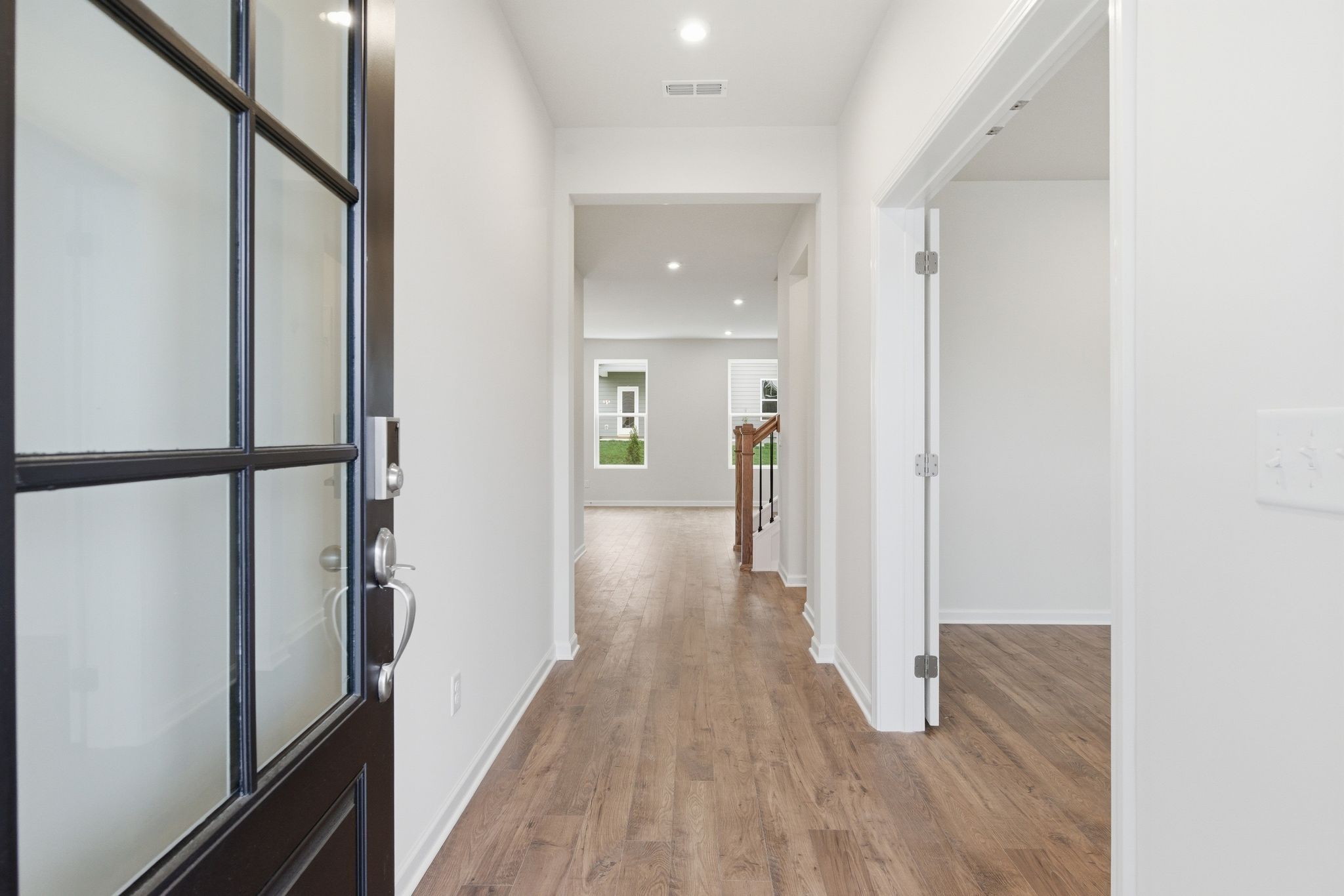 1310 Godwin Road Hermitage, TN 37076 - Photo 4 of 32 a view of a hallway with wooden floor and staircase