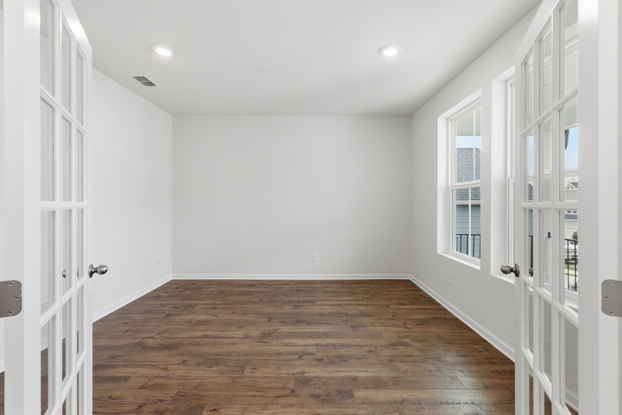 1310 Godwin Road Hermitage, TN 37076 - Photo 5 of 32 a view of an empty room with wooden floor and a window