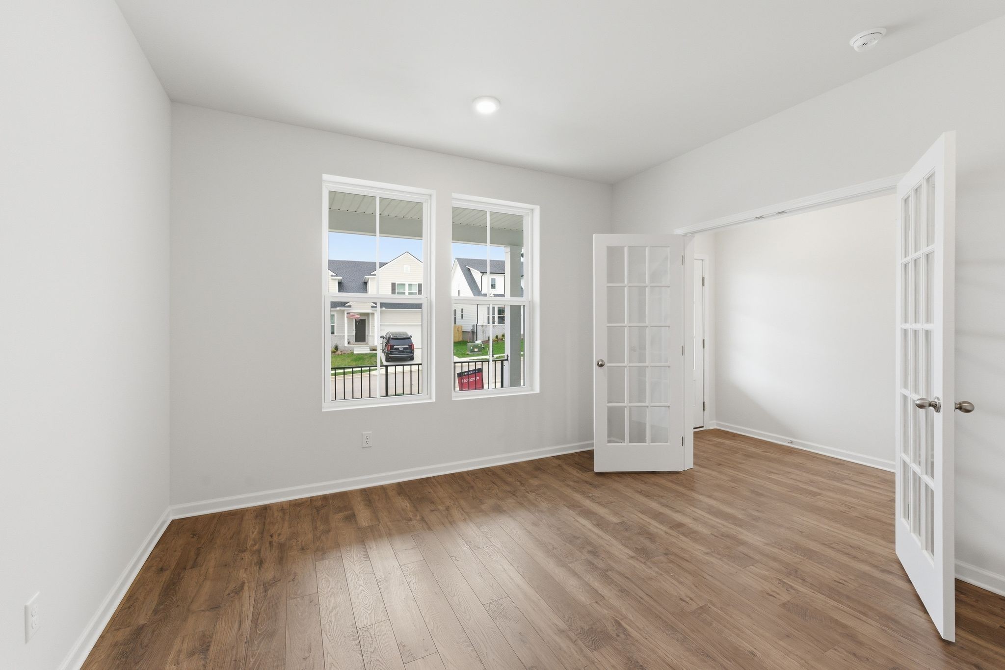1310 Godwin Road Hermitage, TN 37076 - Photo 6 of 32 an empty room with wooden floor and windows