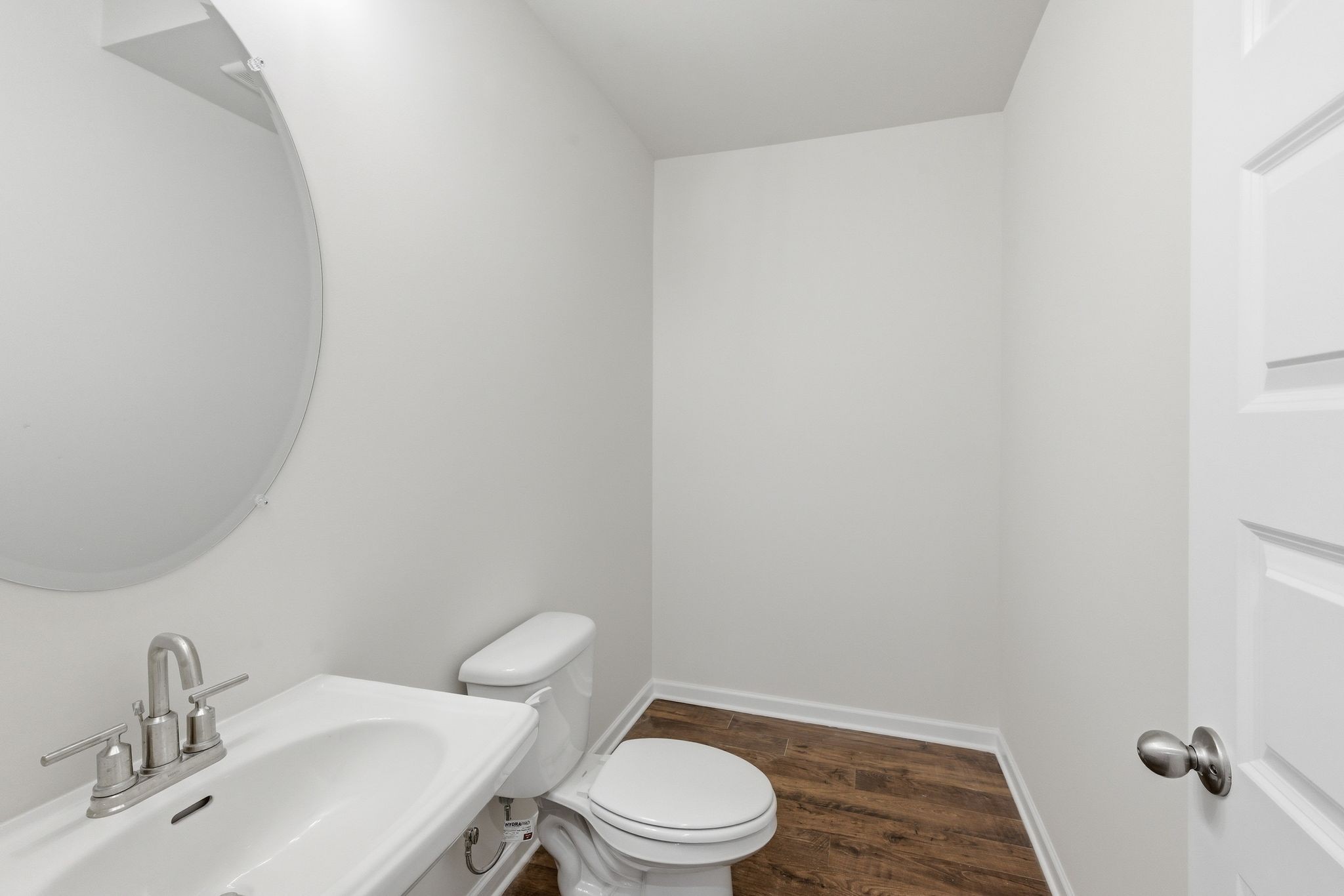 1310 Godwin Road Hermitage, TN 37076 - Photo 8 of 32 a white toilet sitting next to a bathroom sink