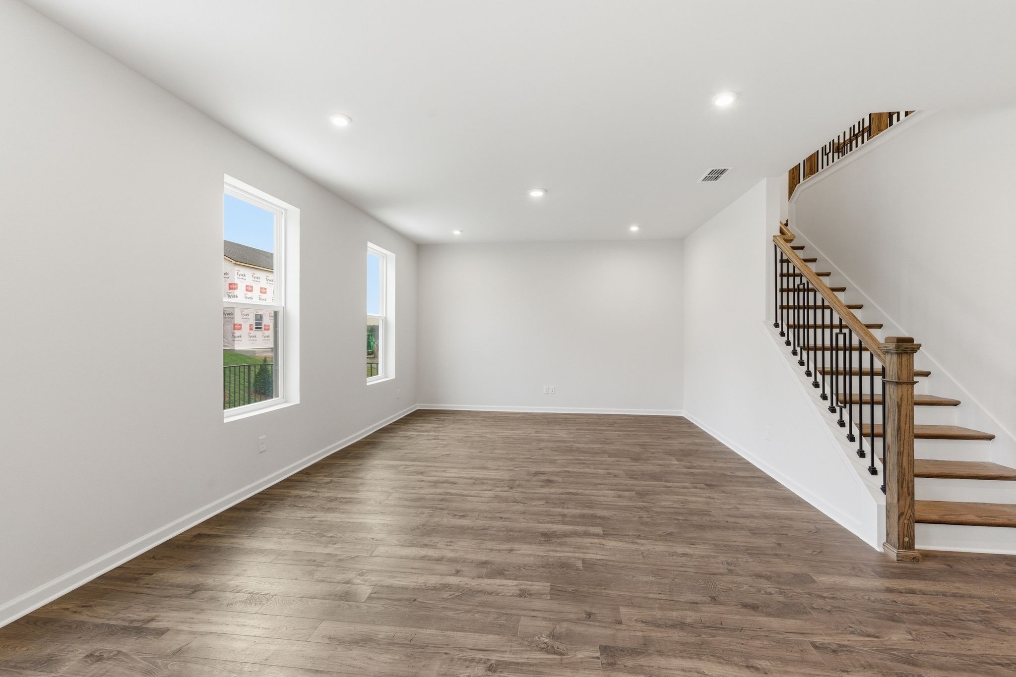 1310 Godwin Road Hermitage, TN 37076 - Photo 9 of 32 a view of an empty room with wooden floor and stairs