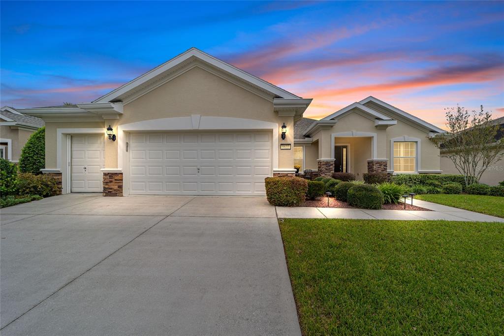 9833 Southwest 63rd Loop Ocala, FL 34481 - Photo 1 of 1 a front view of house with yard and green space