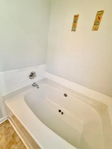 a view of bathroom with a sink and mirror