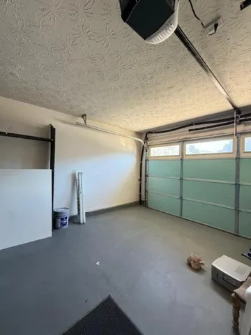 a view of a house with backyard and garden