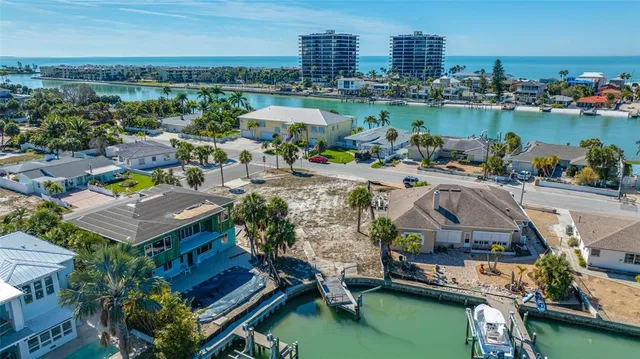 an aerial view of a house with a lake view