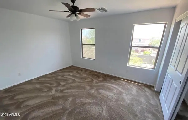 a view of an empty room with a window