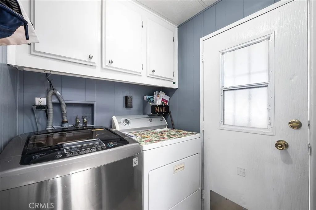 17701 Avalon, Unit SP124 Carson, CA 90746 - Photo 11 of 32 a kitchen that has a sink and cabinets