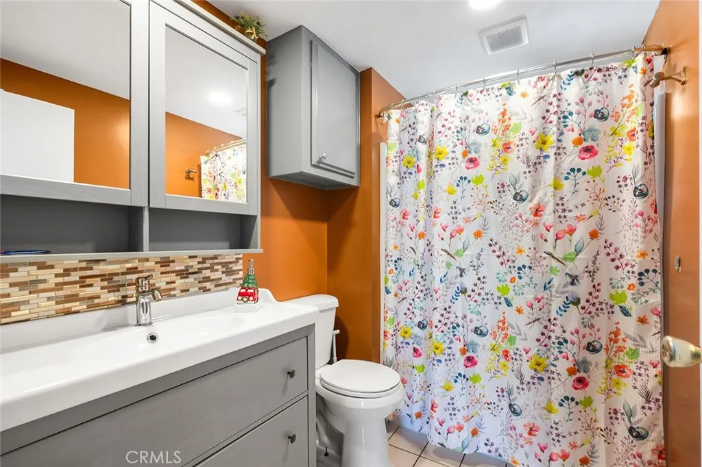 17701 Avalon, Unit SP124 Carson, CA 90746 - Photo 13 of 32 a bathroom with a sink toilet and shower