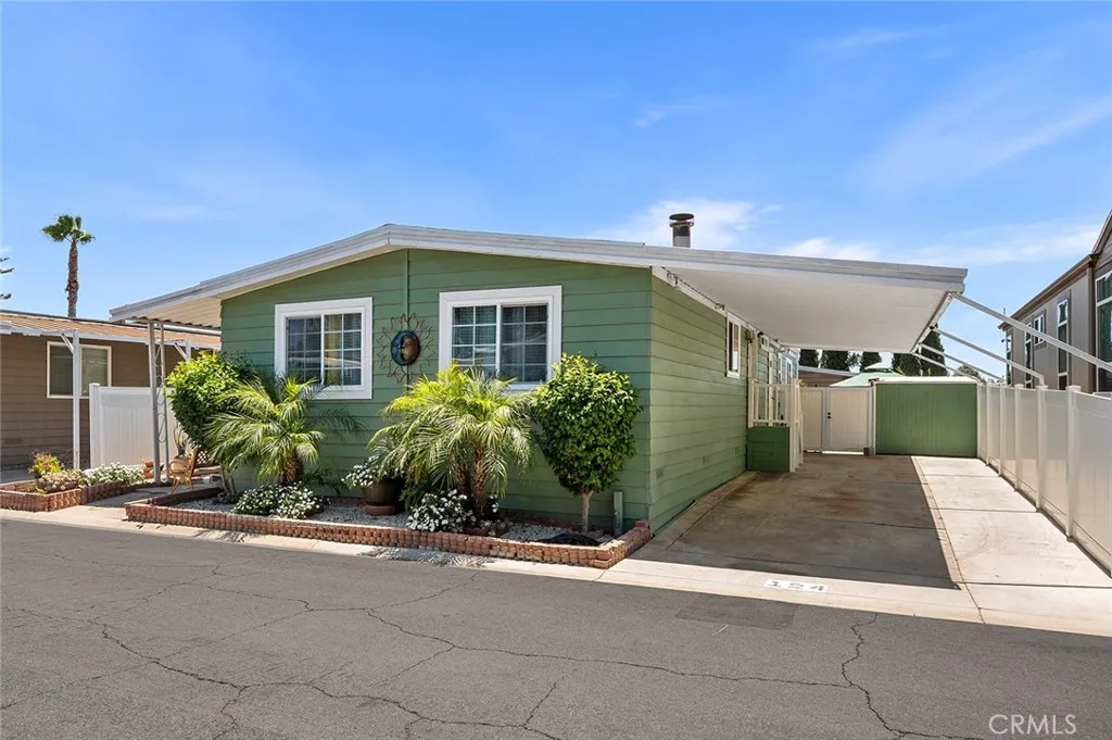 17701 Avalon, Unit SP124 Carson, CA 90746 - Photo 2 of 32 a front view of a house with a yard