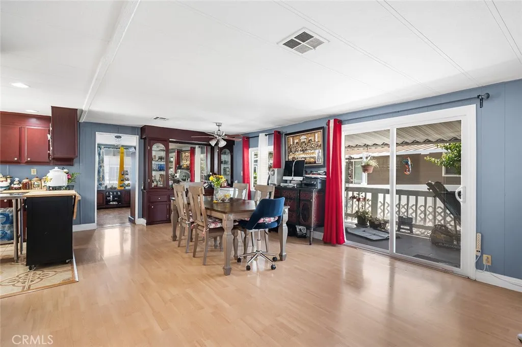 17701 Avalon, Unit SP124 Carson, CA 90746 - Photo 7 of 32 a living room with furniture a dining table and a large window
