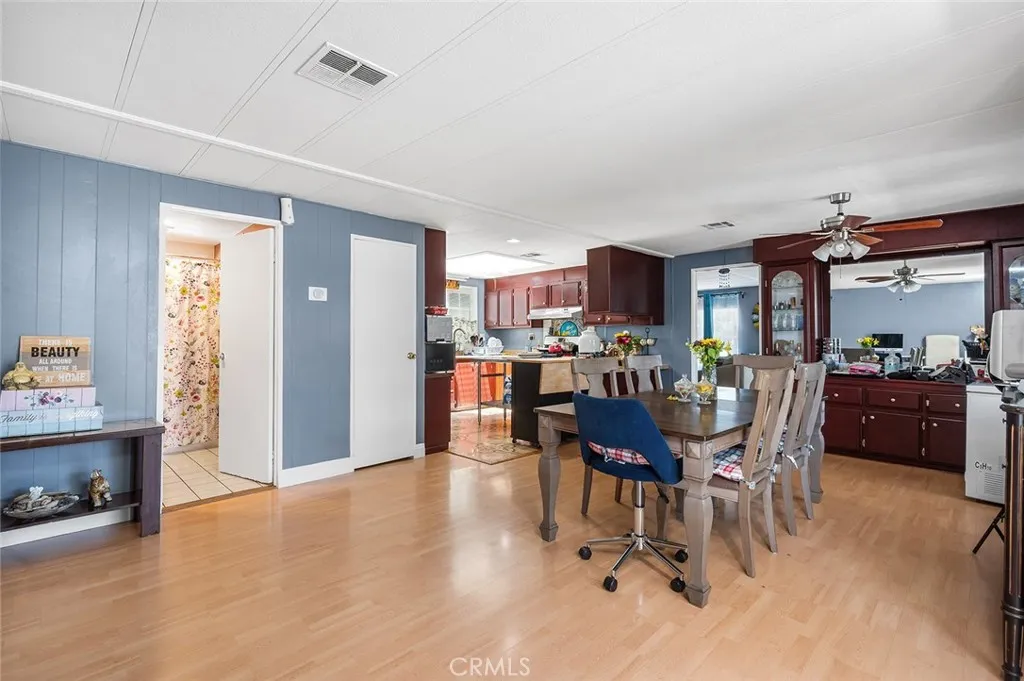 17701 Avalon, Unit SP124 Carson, CA 90746 - Photo 8 of 32 a dining room with furniture and wooden floor