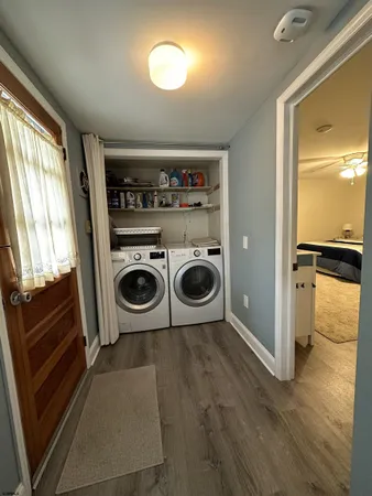 a kitchen with a refrigerator and washer
