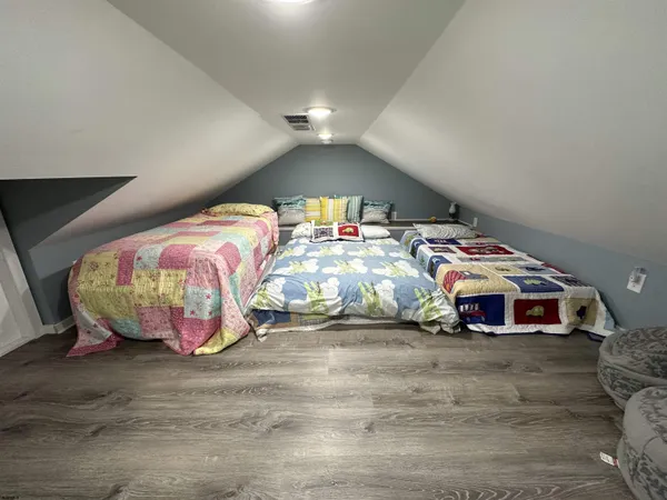 a bedroom with bed and window