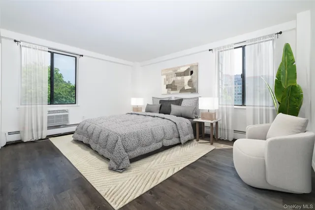 a spacious bedroom with a bed and a large window