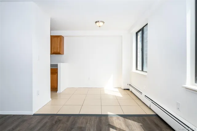 a view of an empty room with windows