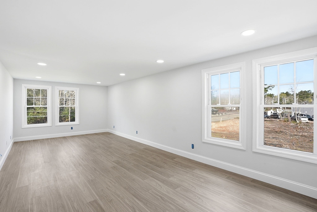 357 Wareham Street Middleboro, MA 02346 - Photo 24 of 42 an empty room with wooden floor and windows