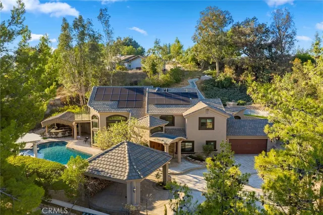 a view of a patio with table and chairs and potted plants