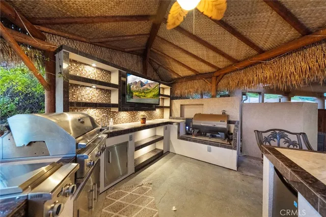 a view of a terrace with couches and sky view