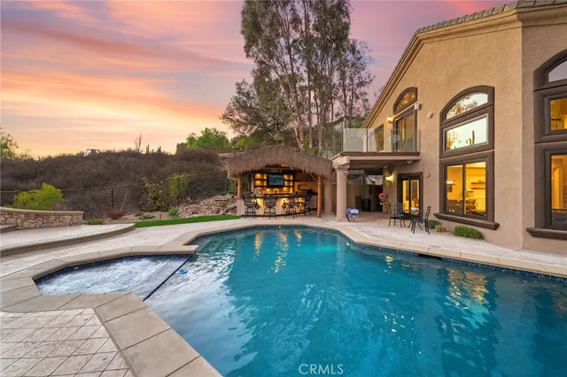 a front view of a house with a yard and a garage